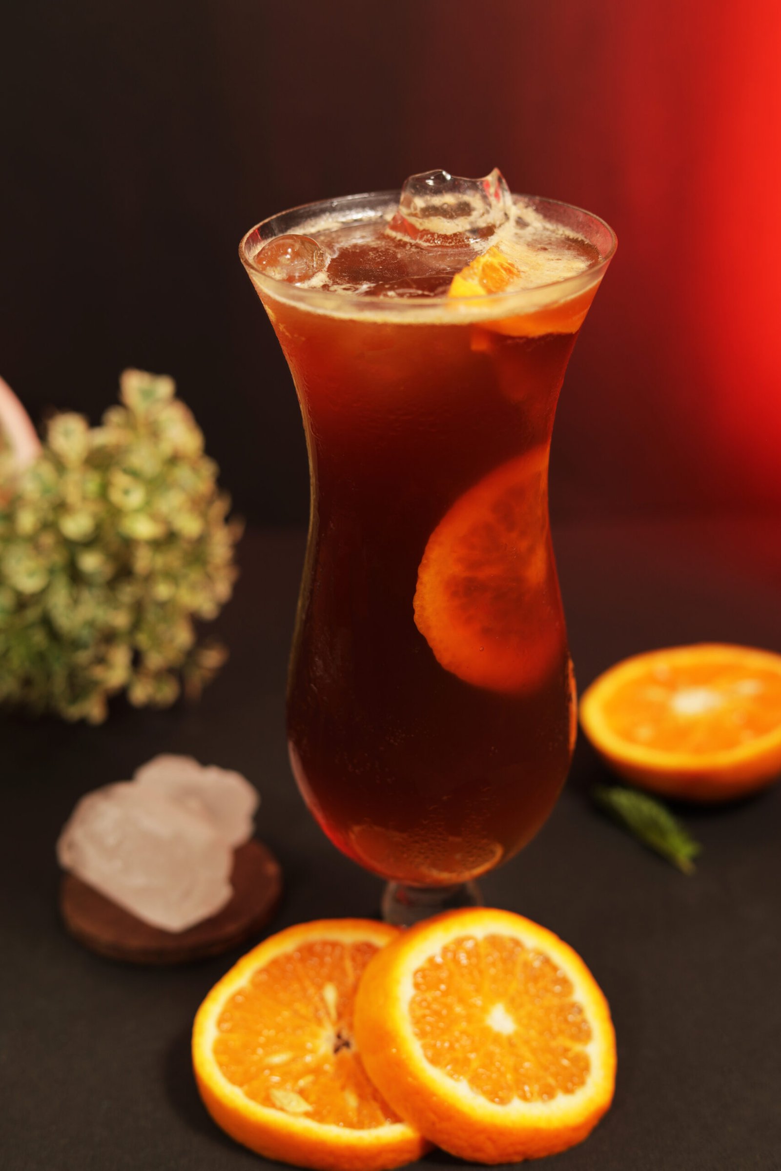 A chilled glass of iced tea with fresh fruit