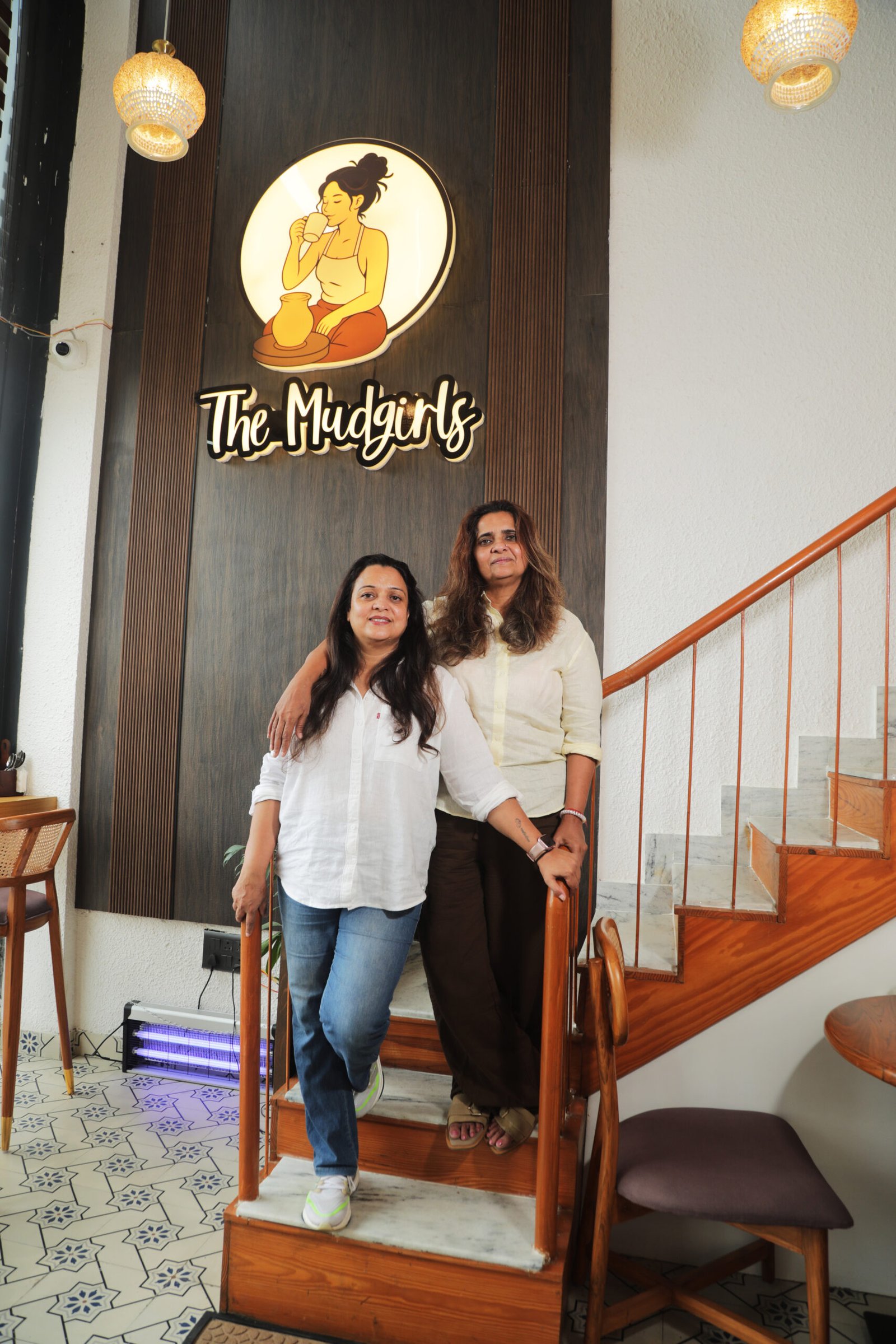 A warm portrait of the café's founders at work in the studio